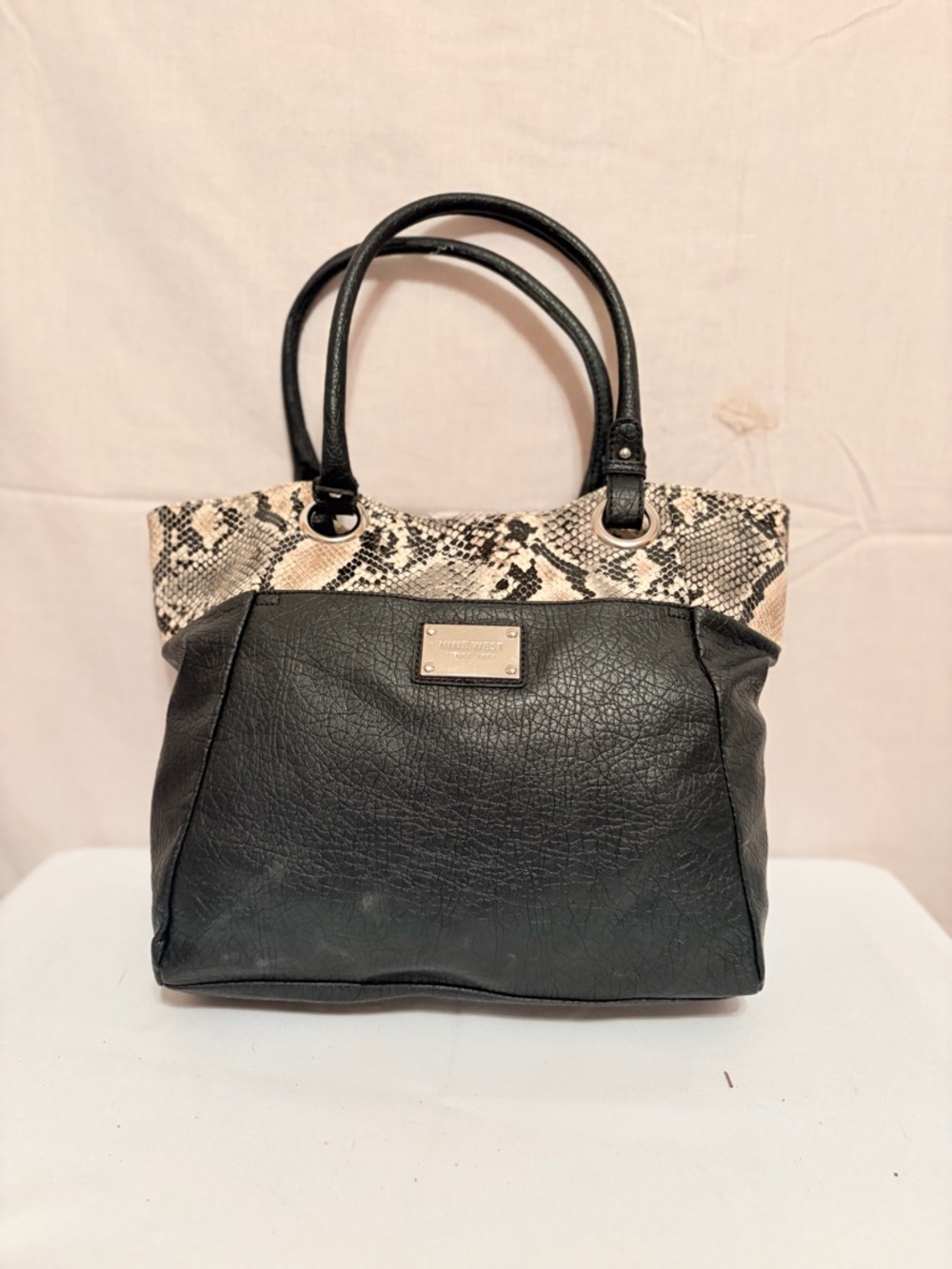Nine West shoulder black faux leather  and a snake print upper section.